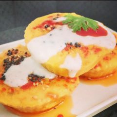A picture of Handvo Muffins with Creamy Cheese Sauce.