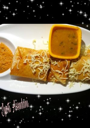 A picture of Masala Dosa with sambhar.