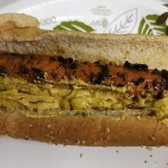 A picture of Smoky Carrot Dogs w/ nacho sauce (vegan).