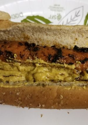 A picture of Smoky Carrot Dogs w/ nacho sauce (vegan).
