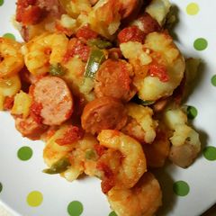 A picture of Shrimp and sausage smash potatoes.