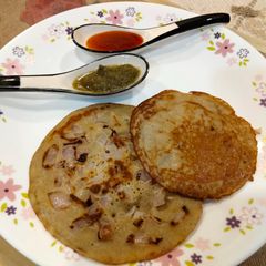 Brown top millet onion uttapam A picture of Brown top millet onion uttapam.