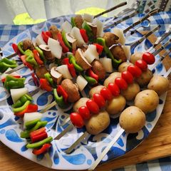 A picture of Grilled veggie kabob with baby potatoes and Grilled pineapple.