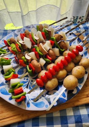 A picture of Grilled veggie kabob with baby potatoes and Grilled pineapple.