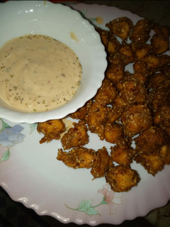 A picture of Dhaka chicken with dip sauce.