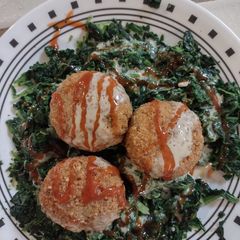 A picture of Falafel & steamed spinach.