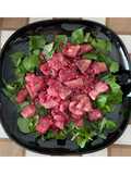 Bocconcini di tacchino con melograno su un letto di rucola
