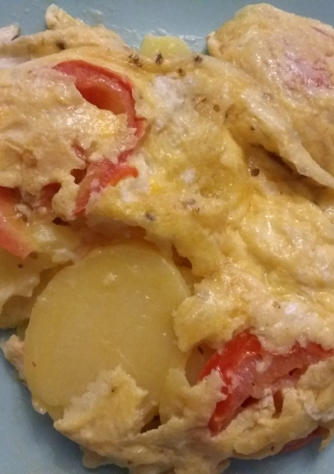 Una foto de Revuelto de patatas y tomate