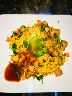 A picture of Timeless chicken noodles and sausage dinner.