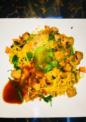 A picture of Timeless chicken noodles and sausage dinner.