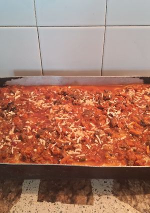 Una foto de Polenta rellena con tuco