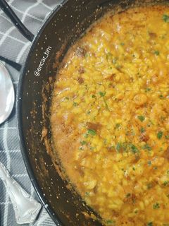 Una foto de Arroz meloso de bacalao y alga dulse