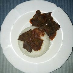 A picture of Rice with wet fry liver.