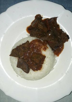 A picture of Rice with wet fry liver.