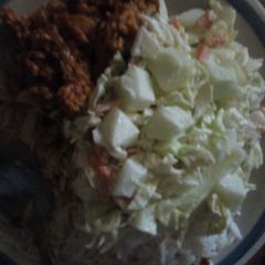 A picture of White rice, salad and stewegg.