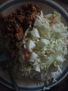 A picture of White rice, salad and stewegg.
