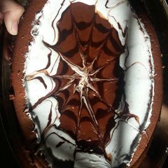 A picture of Chocolate cake with thick sauce.