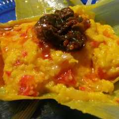 A picture of Humitas en chala.