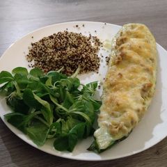 A picture of Cheesy filled zucchini with quinoa.