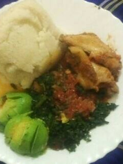 A picture of Ugali,chicken,muchicha/terere with avocado.