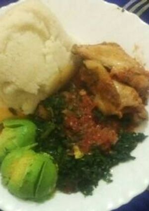 A picture of Ugali,chicken,muchicha/terere with avocado.