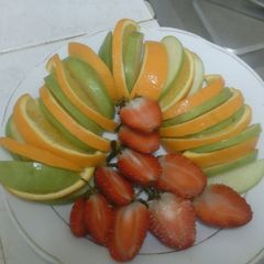 A picture of Strawberry orange apple fruit salad.