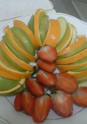 A picture of Strawberry orange apple fruit salad.