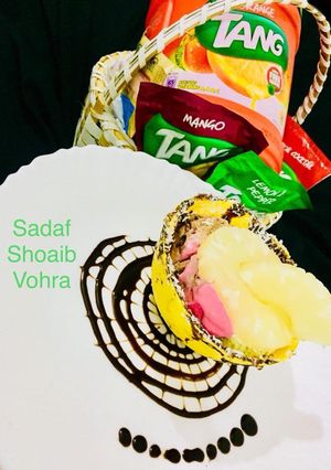 A picture of Ice cream with fruits in chocolate bowl.