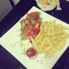 A picture of Chips with vegetables.