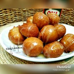 A picture of Puff puff with condensed milk.