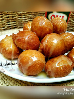 A picture of Puff puff with condensed milk.