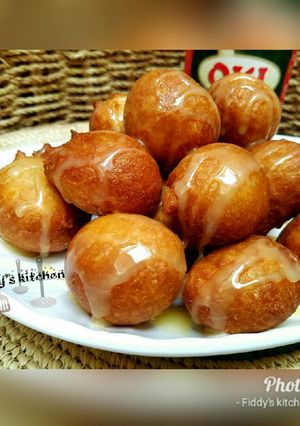 A picture of Puff puff with condensed milk.