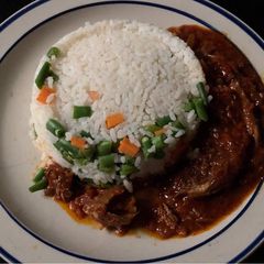 A picture of Smoked fish stew with rice.