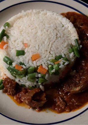 A picture of Smoked fish stew with rice.