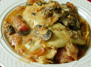 A picture of Ravioli (cheese and spinach stuffed Ravioli) Mushroom cream sauce.