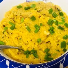 A picture of Garlic semolina upma with dash of cashews.