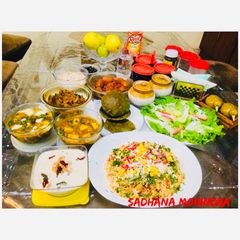 A picture of Potato Butter Masala,Mater-Paneer,Khatta -Meetha Kaddu,Spinach Pooris.