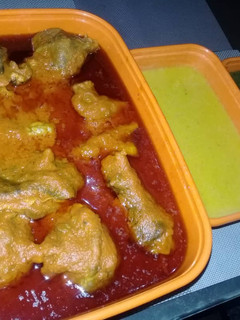 A picture of Goat meat tomato stew.