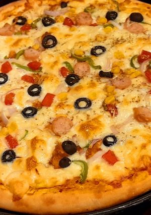 A picture of 🍕Cheesy Smokey tikka pizza🍕.