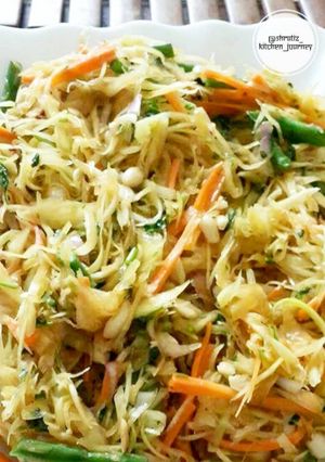 A picture of Som tum salad or raw papaya salad.