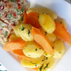 A picture of Boiled potatoes and fried egg.
