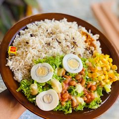 A picture of Rice and beans with salad.