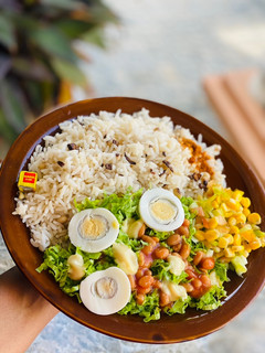 A picture of Rice and beans with salad.