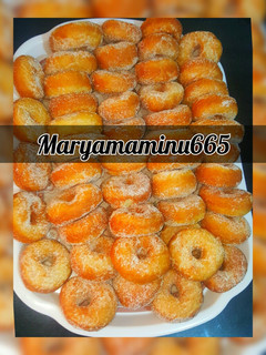 A picture of Doughnut coating with sugar and cinnamon.
