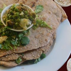 A picture of Butter Garlic Naan with rye, barley and wheat flours.