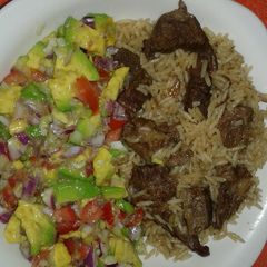 A picture of Beef pilau and guacamole.