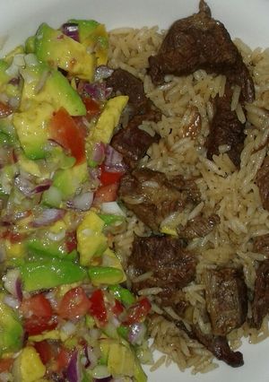 A picture of Beef pilau and guacamole.