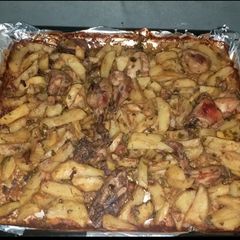 A picture of Baked chicken and potatoes.