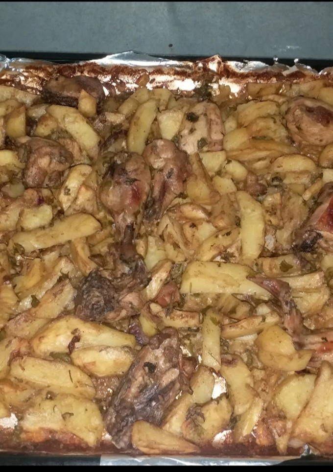 A picture of Baked chicken and potatoes.
