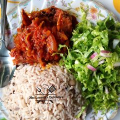 A picture of Rice and Beans with Stew.
